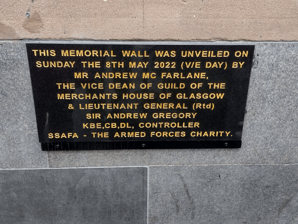 A plaque that gives details of when the Memorial Wall was unveiled