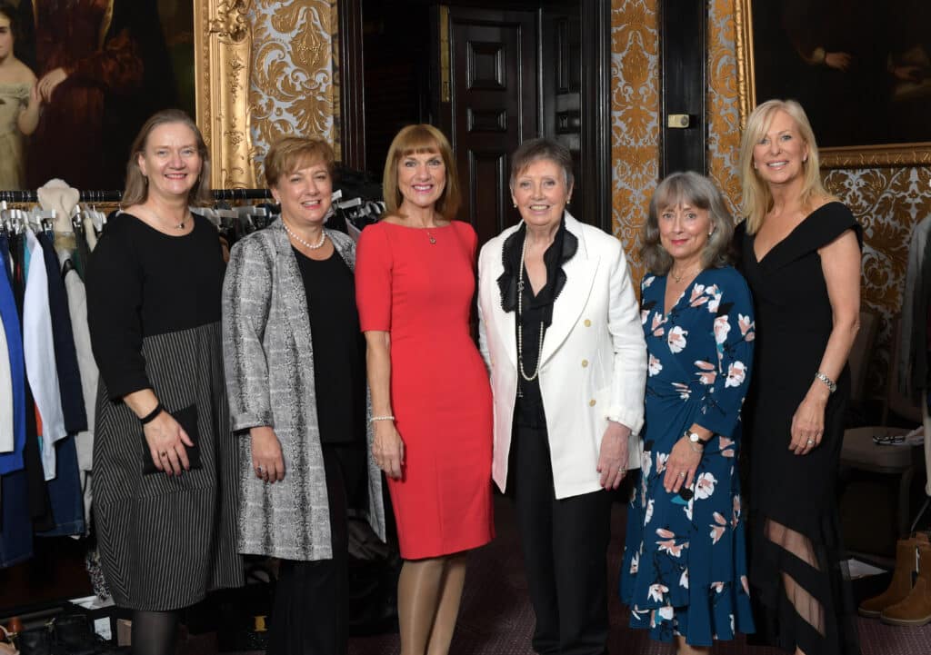 A row of ladies dressed up for the event