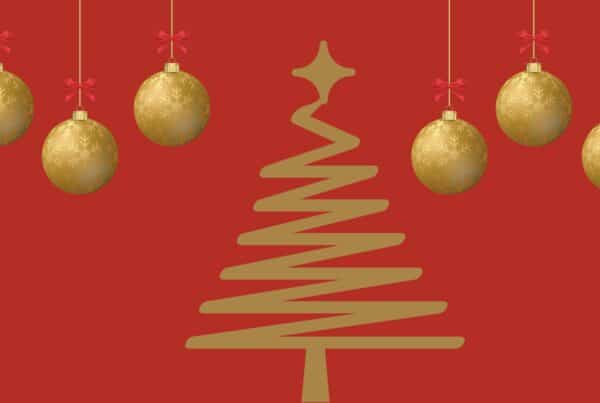 A graphic of a gold Christmas tree with bauble hanging