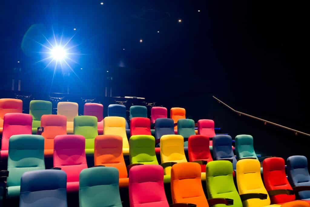 Inside MediCinema which has colourful chairs and space for wheelchairs and hospital beds