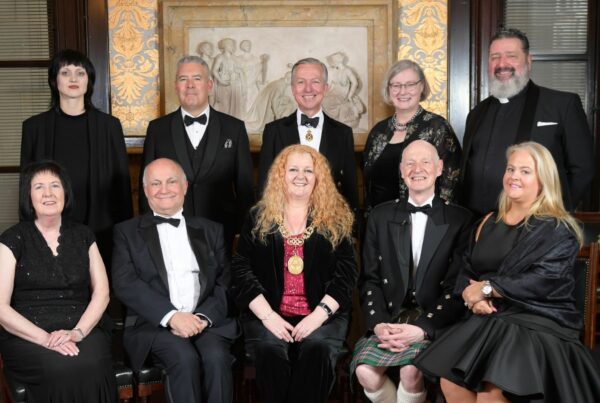 A group photo of the speakers and top table guests at the Valedictory Dinner